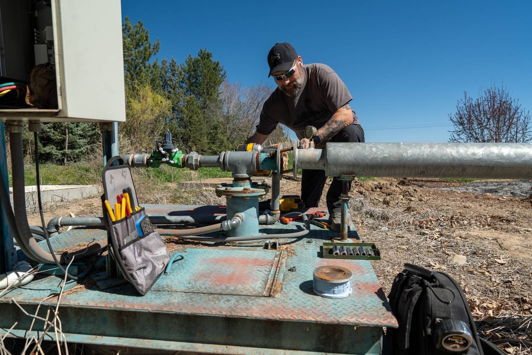 Field technician at a pump service site.